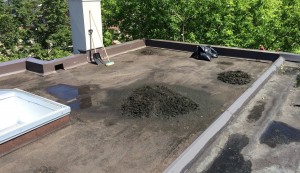 Clean up of gutters, water, and debris by Archer Roofing